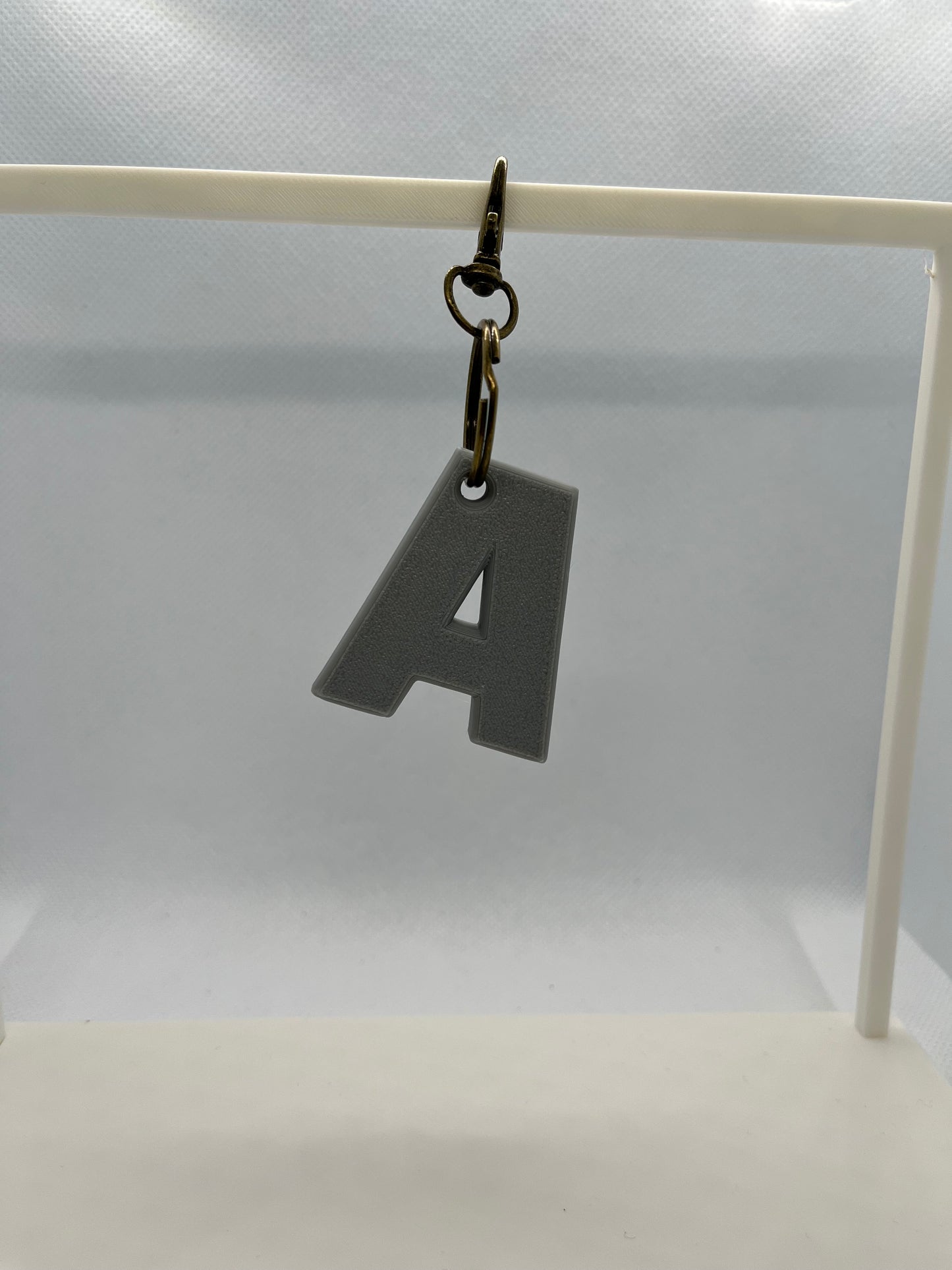 Keychain with a letter 'A' on a white background