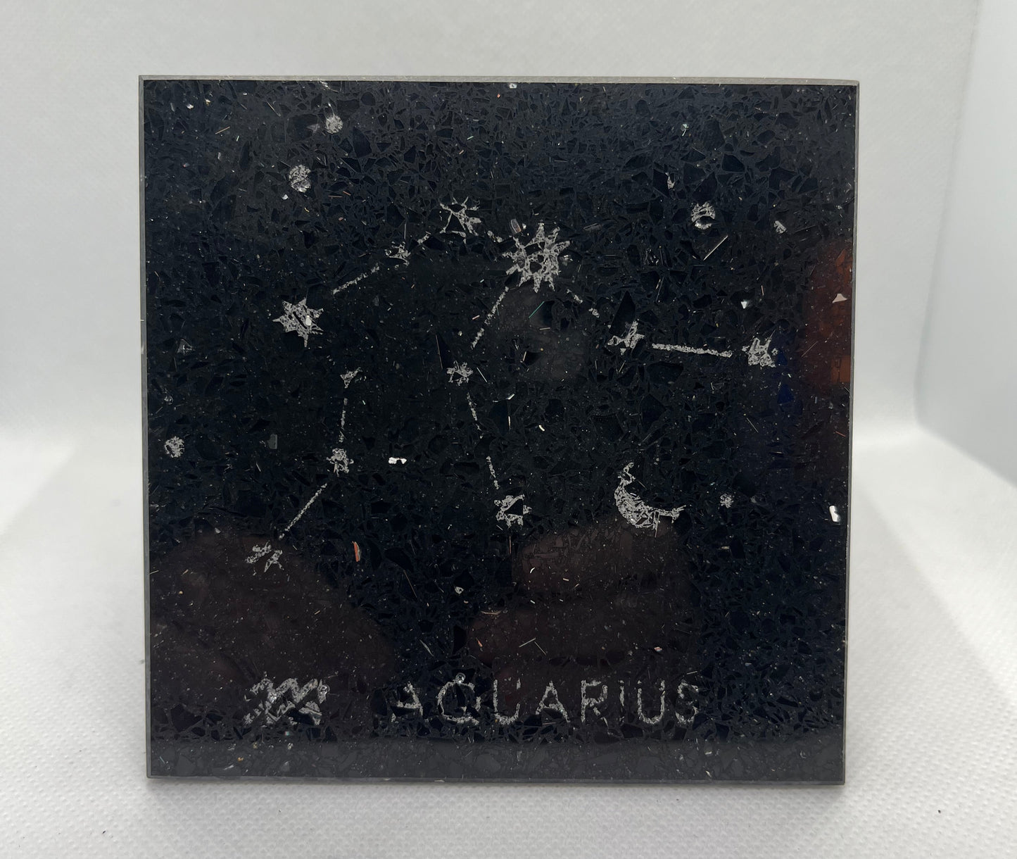 Aquarius zodiac constellation on a black background with 'Aquarius' text.