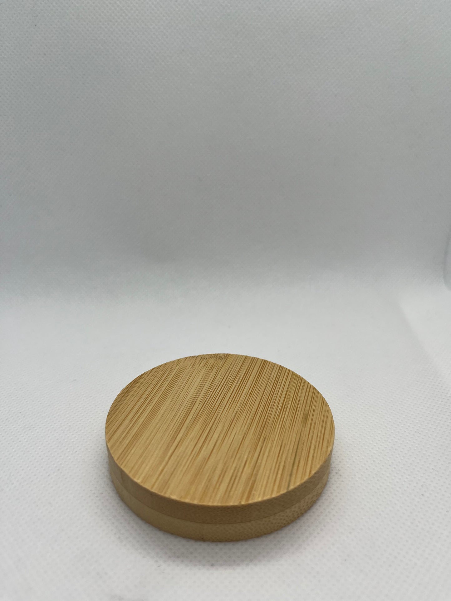 Wooden circular bottle-opener-on a white background