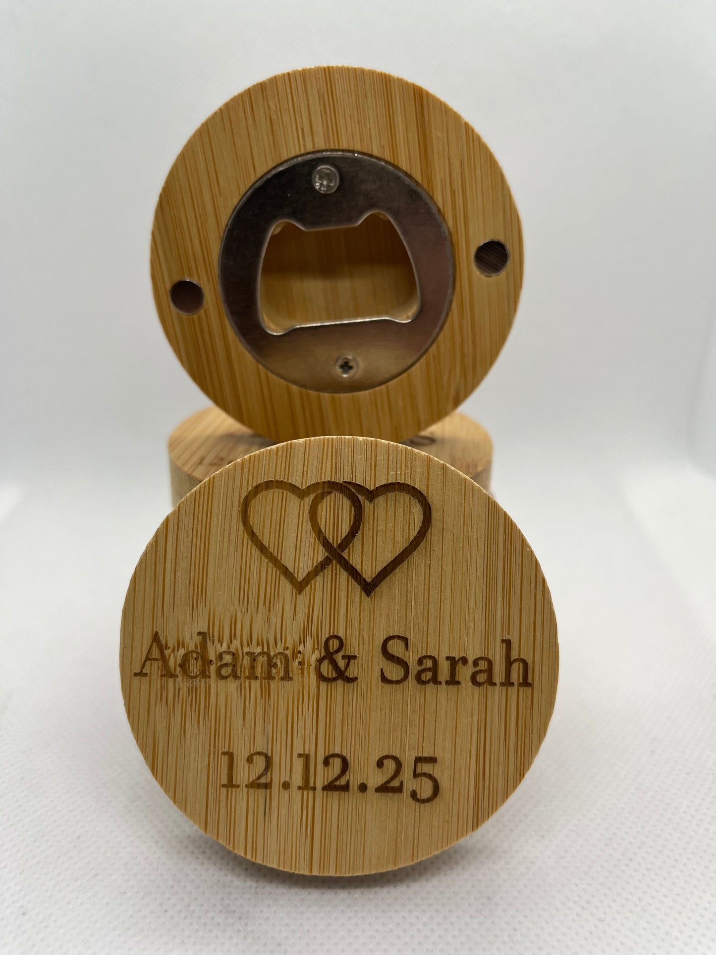 Wooden bottle opener with engraved text on a white background