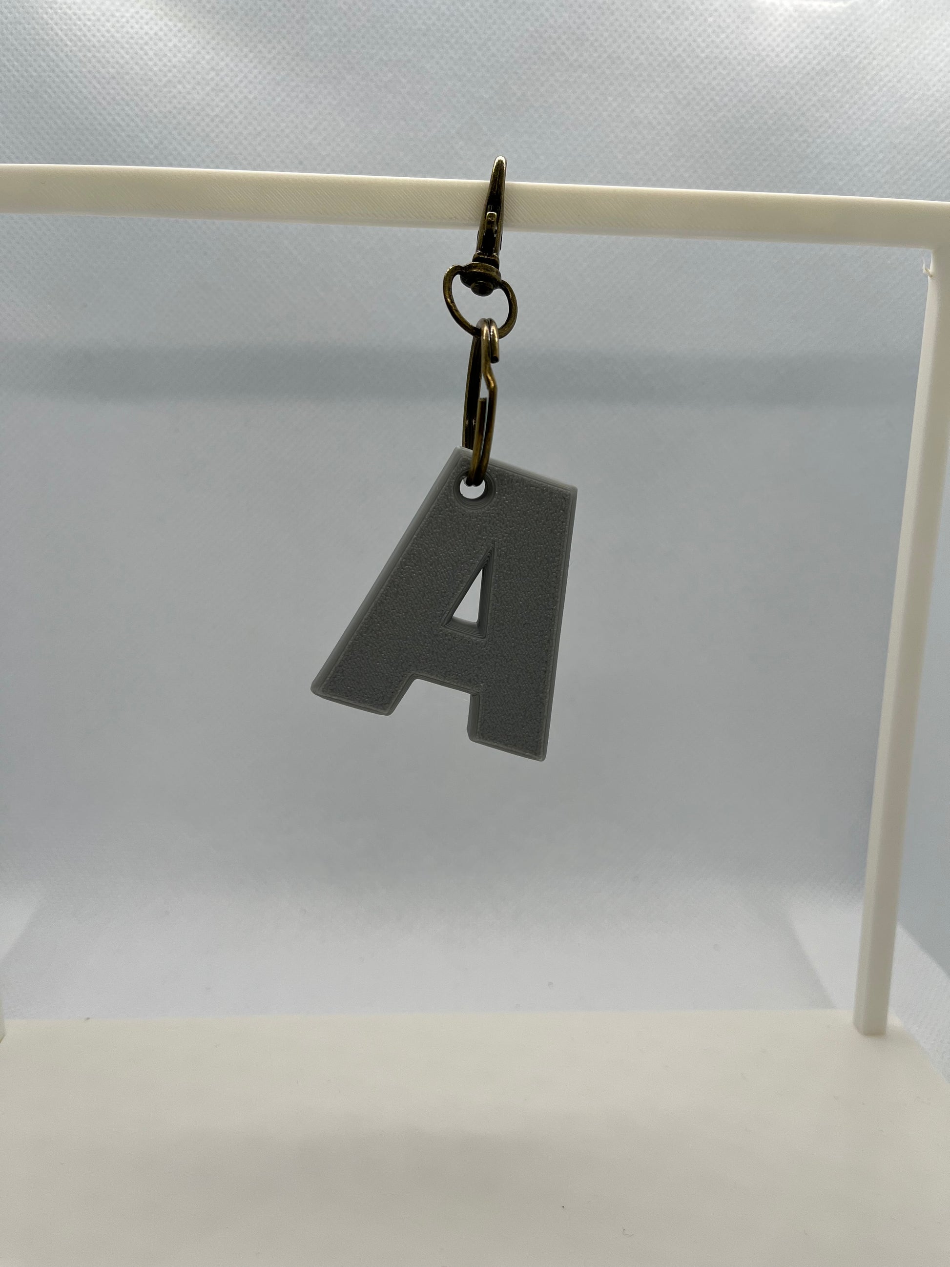 Keychain with a letter 'A' on a white background