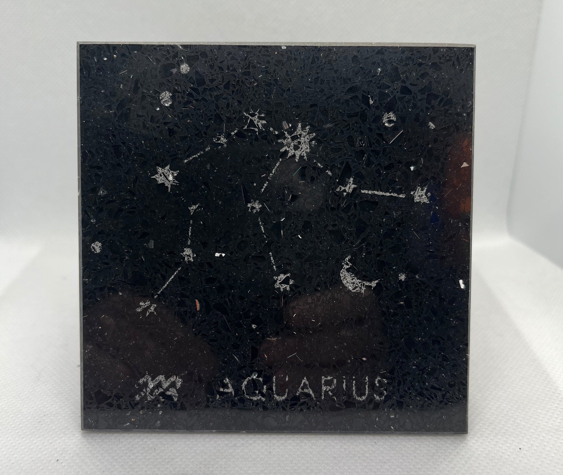 Aquarius zodiac constellation on a black background with 'Aquarius' text.