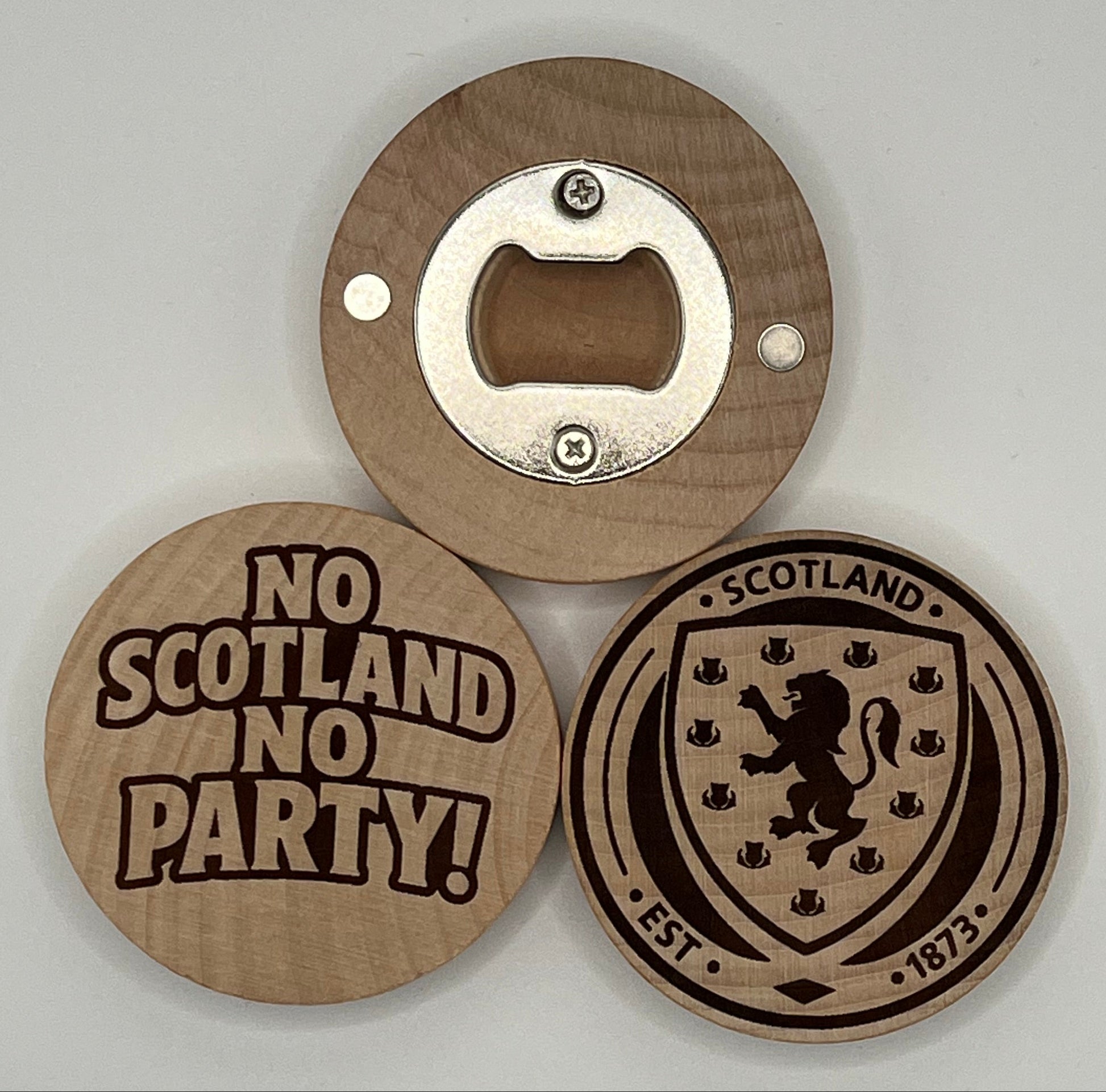 Wooden bottle opener with Scottish design on a gray background