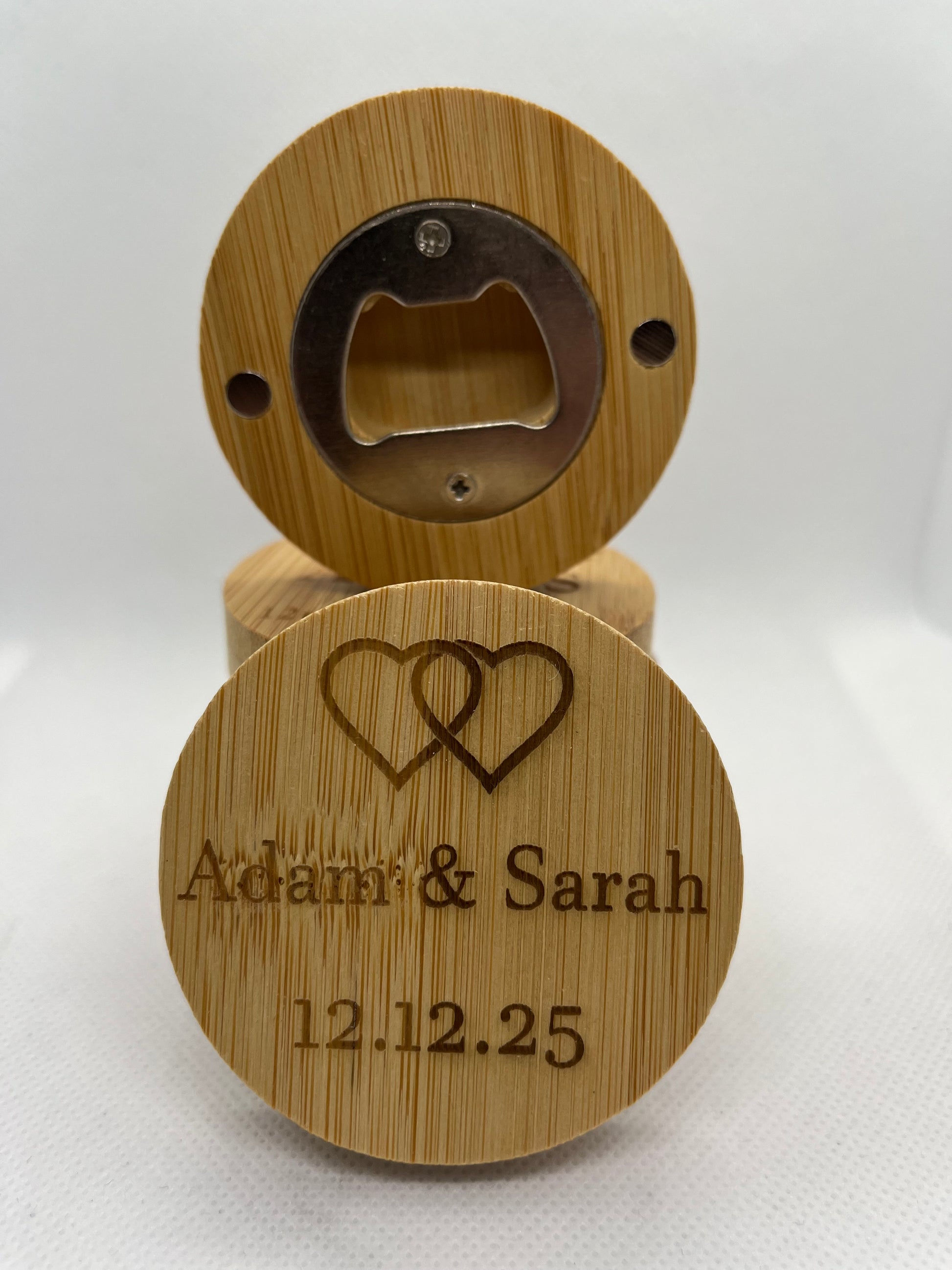 Wooden bottle opener with engraved text on a white background