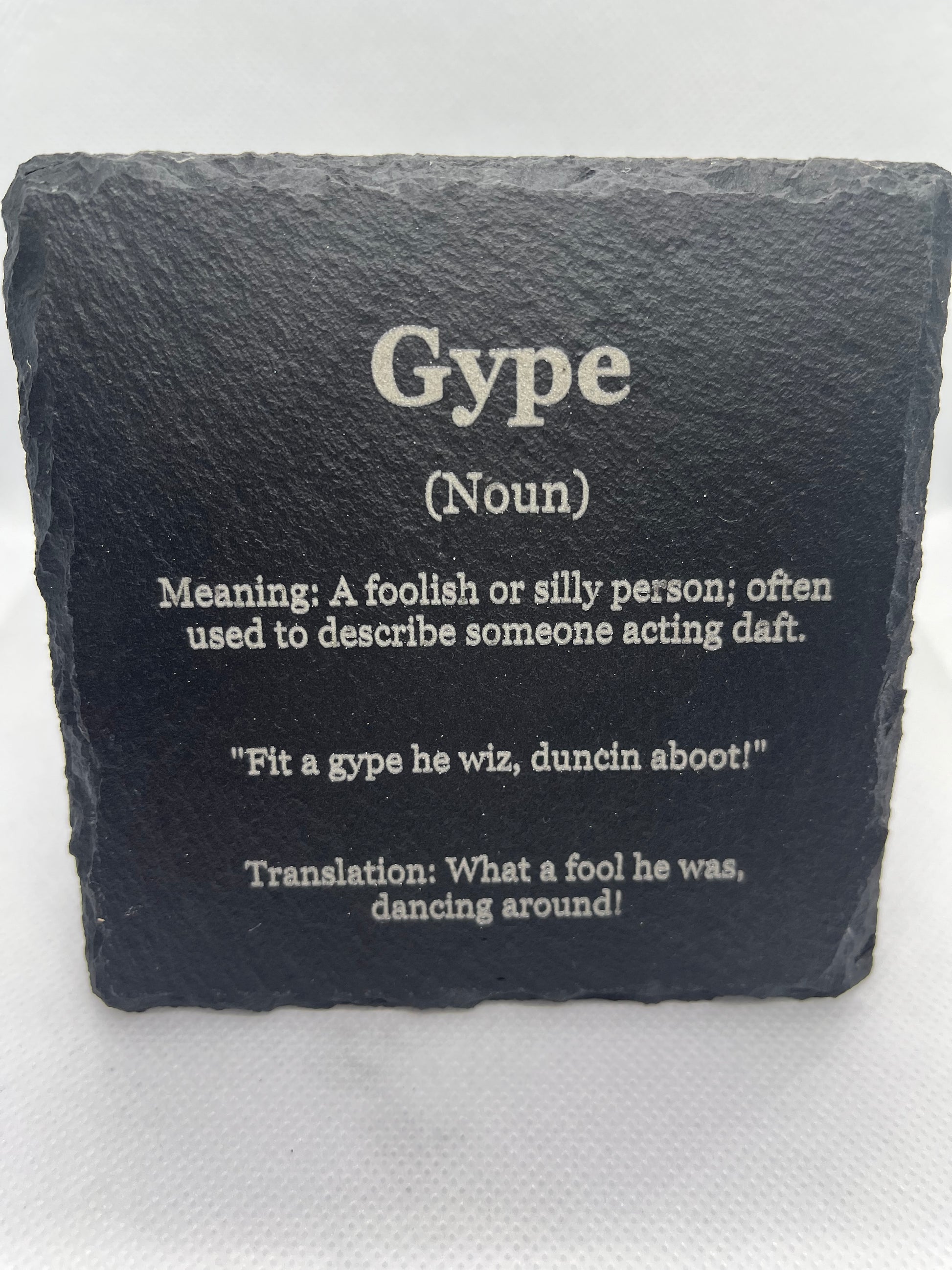 Slate coaster with definition of the word 'Gype' on a white background