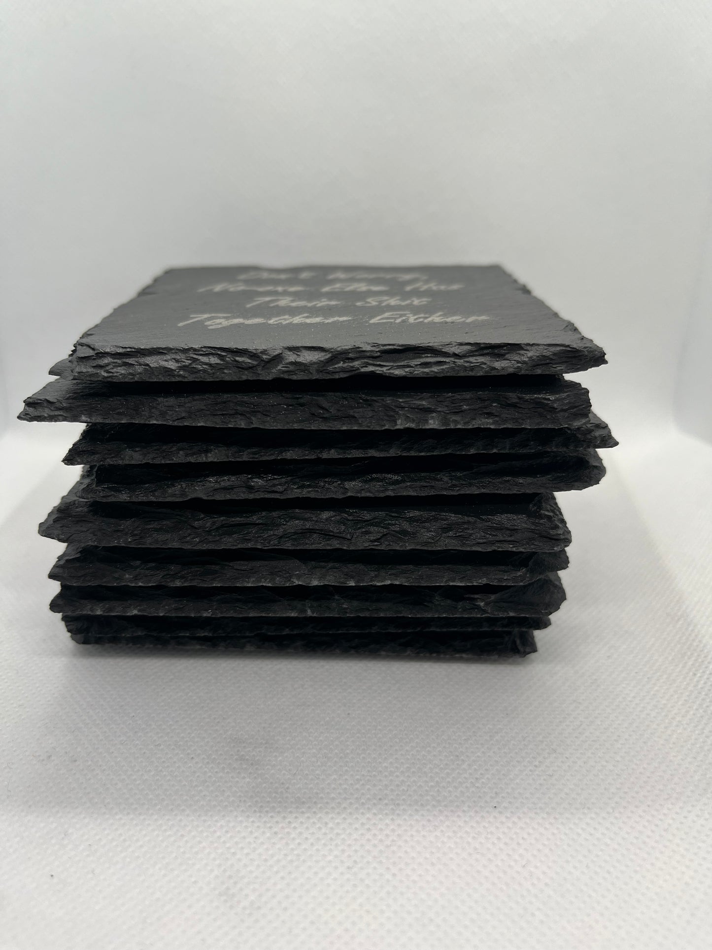 Black stone coaster set on a white surface