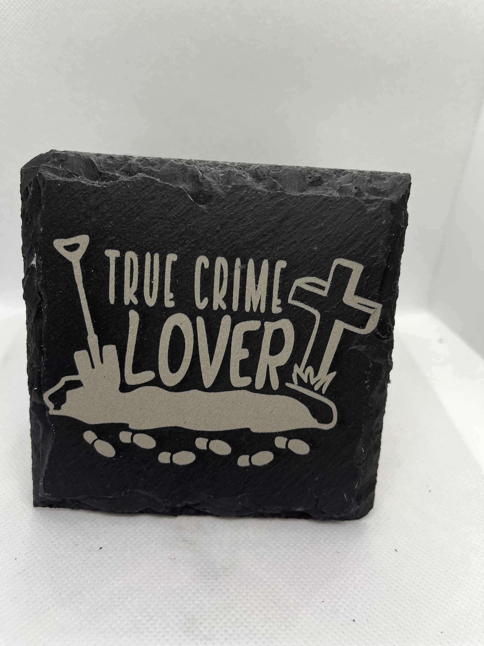 Slate coaster with 'True Crime Lover' design on a white background