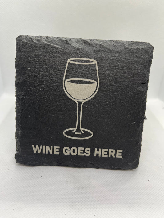 Slate coaster with a wine glass illustration and 'Wine Goes Here' text on a white background